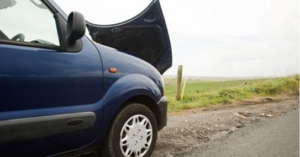 Car with hood up at side of road