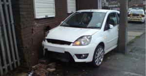 White car parked oddly